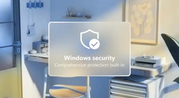Jasne, oto opis alternatywny:

Biurko z komputerem i grafiką "Windows security". Chcesz wiedzieć, jak wyłączyć Windows Defender?