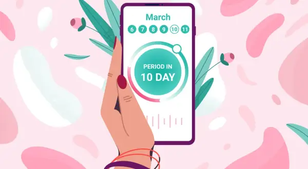 Dłoń trzyma smartfon z aplikacją flo, która pokazuje "PERIOD IN 10 DAY" i daty marca.